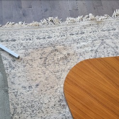 A picture of a customer&s carpet inside what seems to be their living room..